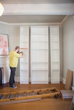 Ikea Billy Bookcases ($40-$60) of various sizes are assembled together to create the three columns of the built-ins. #DIY Deur Ensuite, Ikea Bookcases, Billy Bookcases, Ikea Bookcase, Ikea Billy Bookcase, Books Reference, Ikea Billy