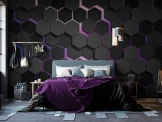 a bedroom with black walls and purple hexagonal tiles on the wall, along with a large bed