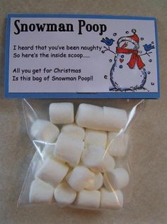 some white marshmallows are in a bag on the table and there is an ad for snowman poop