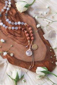 Luminous Trust Mala is hand-knotted with 6mm Chalcedony, Rosewood, Labradorite, & 4mm Faceted Labradorite on silk cord. 14k Goldfilled Hand-wrapped Moonstone drop, Gold Plated 11:11 Crescent Moon Charm, Labradorite drop and 14k Goldfilled and Gold Vermeil accents. 108 Meditation beads. _____________________________ Blue ChalcedonyBlue Chalcedony is a soft blue translucent stone with creamy beige inclusions and swirls. A cooling and mystical stone Blue Chalcedony is known as the “Speaker’s Stone” activating the Throat Chakra promoting ease of communication of ideas, beliefs, and emotions with clarity, openness, and personal truth. Blue Chalcedony is a nurturing stone that absorbs negative energy, eases self doubt, and calms panic, anxiety, and overwhelming thoughts. Soothing and balancing B Artisan Hand Knotted Necklace For Meditation, Artisan Hand Knotted Necklaces For Meditation, Holistic Hand Knotted Round Bead Jewelry, Holistic Hand Knotted Jewelry Gift, Brown Hand Knotted Jewelry For Gift, Overwhelming Thoughts, Personal Truth, Bracelet Size Chart, Meditation Beads