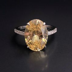 Personally Designed FUSION light yellow citrine ring, set with white topaz side gemstones 💎 Gemstone: Yellow citrine 9*13mm with brilliant cut. 💎 Gemstone Shape: Oval  💎 Material: please select from Sterling Silver with Rhodium plating (immediate dispatch) / 9k gold (3-4 weeks) / 18k gold (3-4 weeks) / platinum (3-4 weeks) 💎 Band Size - please message us if you are not sure about your ring size. 『 Other Precious metal bands are available in 10K, 14K or 24K white gold, rose gold or yellow gold, please contact me for prices.』 ✈ Shipping  ✈ We are based in Jersey Channel Islands In the UK. ✈  UK mainland - 5-10 working days  ✈  Please allow extra time for the post ✈  The rest of the world - 7 -14 Working days  Please check out the rest of my designs! Thank you for my shopping at Chen Ma! Luxury Citrine Rings With Large Stone, Luxury Large Stone Citrine Ring, Citrine Multi-stone Rings Perfect As Gifts, Luxury Citrine Multi-stone Rings, Luxury Silver Citrine Rings, Yellow Citrine Ring, Citrine Jewelry, Party Rings, Channel Islands