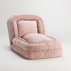 a pink chair that is shaped like a reclining couch with a pillow on it