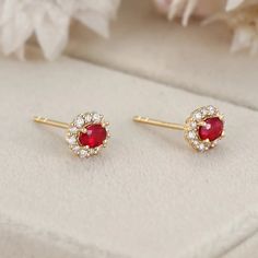 These 18K Yellow Gold Oval Ruby Stud Earrings with a Lab Diamond Halo are the perfect addition to any jewelry collection. Diamond Halo Earrings, Ruby Stud Earrings, Halo Diamond Earrings, Ruby Earrings Studs, Halo Earrings, Red Gemstones, Affordable Jewelry, Diamond Halo, Lab Diamonds