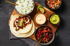 the meal is ready to be eaten and served on the wooden platter, along with other foods