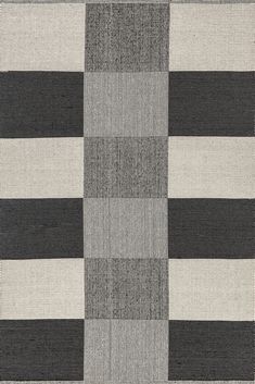 a rug with black and white squares on it