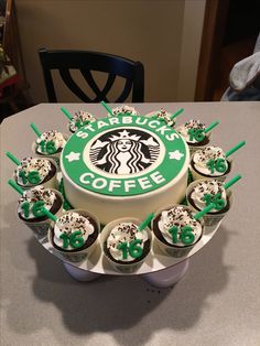 a starbucks cake with cupcakes in front of it