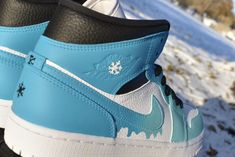 Custom made Jordan 1s. Starts with a gift box blue and fades into a turquoise with a dripping Nike symbol. Shoe represents melting ice. Prices are higher because the base shoes are a lot harder to get as the growing popularity of Jordan 1 mid increases. If you want the same design on a airforce 1 mid just select that option! The picture is just a mock-up and the real shoe will be the same colors as the Jordan 1 mid! Made with Angelus paint, paint is permanent. If you choose to receive a custom b Blue Low-top Sneakers For Gift, Airforce 1 Mid, Custom Made Jordans, Gift Box Blue, Angelus Paint, Jordan 1 Mids, Nike Symbol, Sneaker Art, Jordan 1s