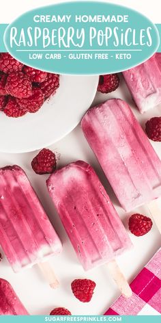 raspberry popsicles on a white plate