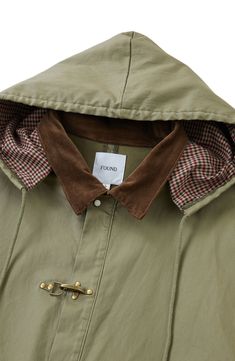 Inspired by hunting jackets from the '80s, this longline coat features antiqued fireman clasps at the placket and pearlescent snaps at the sleeves and pockets. Point collar; drawstring hood Four-snap cuffs Storm flap Water-resistant 92% cotton, 4% polyester, 4% other fibers Machine wash, tumble dry Imported Utility Hooded Outerwear With Buttons, Vintage Hooded Hunting Outerwear, Vintage Hooded Outerwear For Hunting, Hooded Raincoat With Button Closure For Fall, Utility Fall Parka With Storm Flap, Fall Utility Parka With Storm Flap, Utility Parka With Storm Flap For Fall, Fall Outdoor Outerwear With Button Cuffs, Fall Hunting Khaki Outerwear