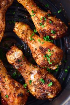 chicken wings with herbs and seasoning in a glass dish