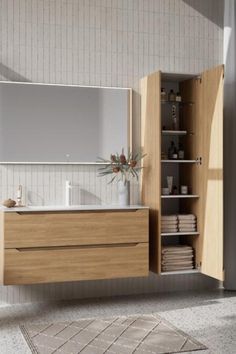 a bathroom with a sink, mirror and shelving unit in the middle of it