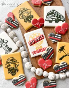 decorated cookies are arranged on a cutting board with the words off duty, one you're