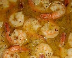 some shrimp is cooking in a pot with broth