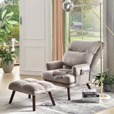 a living room scene with focus on the chair and ottoman