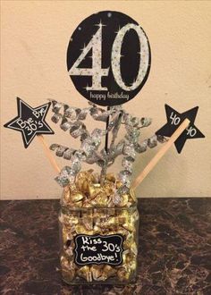 a jar filled with chocolates and candies on top of a table