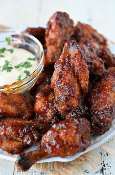 chicken wings on a plate with ranch dressing