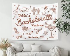 a white couch sitting in front of a wall tapestry with the words bachelor weekend written on it