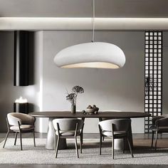 a modern dining room with an oval table and chairs