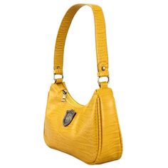 Features: Metal badge icon, zipper closure, and interior zipper pocket. Material: Synthetic Leather Dimensions: 11"L x 8.5"H x 4"D Care: Wipe clean with a damp cloth Retro Satchel Shoulder Bag With Zipper Closure, Retro Satchel Baguette Bag With Zipper, Yellow Satchel Shoulder Bag With Zipper, Retro Satchel Baguette Bag With Zipper Closure, Retro Shoulder Bag With Zipper For Shopping, Retro Shoulder Bag With Zipper Closure For Shopping, On-the-go Yellow Shoulder Bag With Zipper Closure, Yellow Satchel Shoulder Bag With Zipper Closure, Yellow Shoulder Bag With Zipper Closure For On-the-go