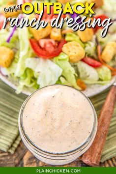 a salad with dressing in a small glass jar