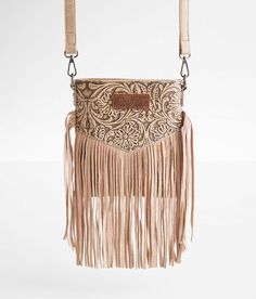 Wrangler® Vintage Leather Fringe Crossbody Purse - Brown , Women's Khaki Tooled floral distressed fabric lined purse Zipper closures Interior zipper and pouch pockets Removable shoulder strap Dimensions: 7 1/2(L) x 1 1/2(W) x 8 1/2(H). Due to the nature of leather/suede, small variances of color in the skin may occur, this is in no way considered a defect. These are inherent characteristics of leather/suede and will enhance the individual look of your garment.. Main: PU/Leather. Lining: Polyeste Country Purses, Cowgirl Purse, Leather Fringe Purse, Fringe Crossbody Purse, Wrangler Vintage, Distressed Fabric, Western Handbags, Western Purses, Cute Country Outfits