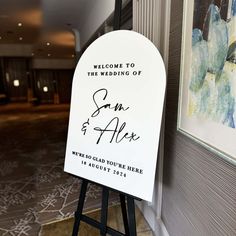 a welcome sign for the newly married couple to arrive at their wedding reception in an elegant hotel lobby