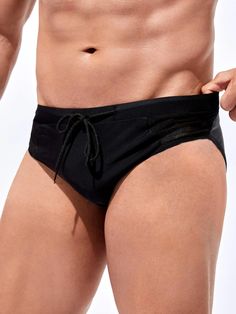 Elevate your beach attire with our Mesh Waist Swim Brief, a must-have addition to your swimwear collection. In classic black, this brief features a plain pattern and an eye-catching contrast mesh detail, adding a modern edge. The medium-stretch fabric ensures a comfortable fit, allowing you to enjoy your time in the water. Features: Color: Black Pattern Type: Plain Details: Contrast Mesh Type: Briefs Fabric: Medium Stretch Material: Fabric Care Instructions: Hand wash, do not dry clean Size Char Sporty Stretch Swim Trunks For Water Polo, Fitted Black Nylon Swim Trunks, Summer Nylon Swim Trunks Brief, Beach Season Stretch Swim Trunks Brief, Breathable Stretch Swim Trunks For Beachwear, Breathable Solid Swimwear For The Beach, Black Nylon Swimwear For Summer, Sporty Nylon Brief Swim Trunks, Beachwear Mesh Bottoms For Beach