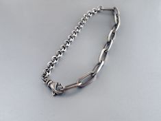 "Men's two chain sterling silver bracelet. Compactly made 4.3 mm cable and large 5.6 mm oval link chain (links about 12 mm long) combined into one bracelet with large high quality swivel teardrop clasp. Simple, biker-tough, with a bit of unconventional. Medium weight. Choose your length: 5 1/2 , 6, 6 ½, 7, 7 ½, 8, 8 ½, 9, 9 ½, 10 inches. Designed for men. Chain has been medium oxidized, then given a faint brushed finish and lightly polished, giving the bracelet a kind of vintage-rustic-masculine Modern Sterling Silver Bracelet With Rolo Chain, Modern Sterling Silver Rolo Link Bracelet, Silver Oval Link Chain Bracelet With Hook, Hand Jewellery, Men Chain, Kailua Kona, Chain Links, Copper Bracelet, Jewelry Photography