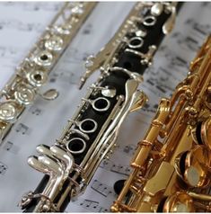 an assortment of musical instruments sitting on sheet music