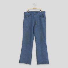 "Size 33x31 Vintage 80s Levi's 517 Flared Jeans Levis Light Blue Orange Tab Denim Levi's 517 Wide Leg Pants Levi's Zipper High Rise Jeans W33 Please contact me for any questions about this clothing before buying. SIZE MEASUREMENTS :- WAIST : 33\" inches HIPS : 40\" inches THIGH: 24\" inches  LEG OPENING : 19\" inches RISE : 11.5\" inches INSEAM : 31\" inches OUTSEAM (TOTAL LENGTH) : 42\" inches WEIGHT : 0.70 kg Condition : Distressed faded dirty jeans Good Vintage Conditions. Please pay close at Retro Style Denim Blue Cotton Pants, Retro Blue Pants With Five Pockets, Blue Retro Pants With Five Pockets, Vintage Blue Mid-rise Pants, Vintage Denim Blue Cotton Pants, Retro Denim Pants With Standard Cut Leg, 1970s Denim Bottoms With Pockets, 1970s Style Denim Bottoms With Pockets, Vintage Jeans With Pockets