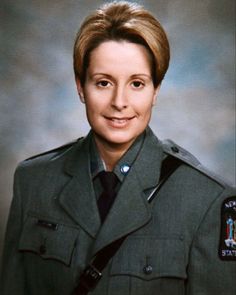 a woman in uniform posing for a photo