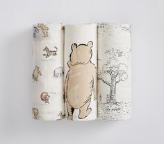 three rolls of paper with winnie the pooh images on them, each rolled up in half