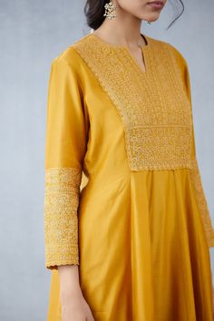 Editor's Note Featuring Yellow Sunehra Saanvi Kurta With Pants Color: Yellow Fabric: Handwoven Chanderi Component: Kurta and Pants Care: Dry Clean Only About the Designer Torani by Karan Torani stands handcrafted luxury inspired by the myriad tales of Indian mythology. Torani is a potpourri of all things nostalgic that binds you with a memory long forgotten. The label works with and revives timeless Indian textiles and embroidery traditions. Suit Embroidery, Indian Mythology, Indian Suit, Simple Kurti Designs, Embroidery On Kurtis, Indian Textiles, Indian Suits, Embroidery Blouse Designs, Kurta With Pants