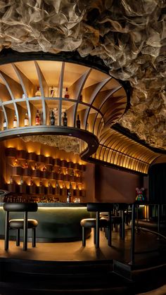 the interior of a bar with stools and shelves