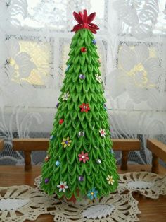 a green christmas tree made out of paper