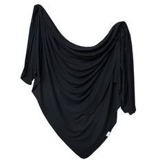 a black cloth draped over the top of a white wall