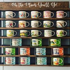 coffee mugs are lined up on a shelf with the words, oh the places you'll go