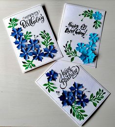 three birthday cards with blue flowers on them