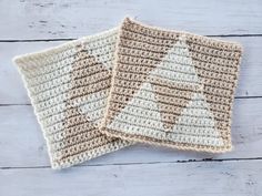 two crocheted placemats sitting next to each other