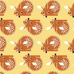 an orange and white animal pattern on a yellow background