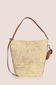 This bag has an interwoven design features a leather adjustable shoulder strap a leather removable pouch and a magnetic fastening.    raffia 100%    made in italy Beige Bucket Bag With Intrecciato Weave For Vacation, Luxury Woven Leather Straw Bucket Bag, Casual Bucket Straw Bag With Intrecciato Weave, Straw Bucket Shoulder Bag With Intrecciato Weave, Vacation Beige Shoulder Bag With Intrecciato Weave, Vacation Shoulder Bag With Intrecciato Weave And Double Handle, Natural Straw Satchel With Removable Pouch, Natural Straw Satchel Bag With Removable Pouch, Luxury Straw Bucket Bag With Woven Leather