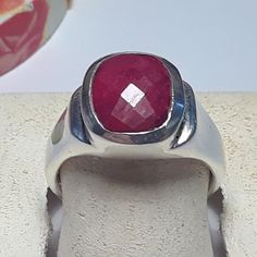 This Non-Gender Classy Ring Features A 10 X 8mm Natural Cushion Checkerboard Cut Ruby, Bezel Set On A Dropped Sides Sterling Mounting. The Ring Measures Aprox 1/2" In Width & Weighs Aprox 6.394 Grams Of Solid (Stamped 925 Inside The Shank) Sterling Silver. This Non-Gender Classy Bezel Ruby Ring Has A Msrp Of $699.00. Finger Size 7 (This Ring Can Be Sized By Your Local Jeweler, At Your Cost, We Do Not Size, Sorry) Classy Ring, Natural Cushions, Ruby Ring, Cushion Cut, Bezel Setting, Womens Jewelry Rings, Sterling Silver Ring, Lady In Red, Silver Ring