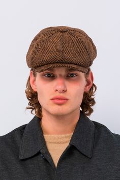 Introducing our Newsboy Cap in Brown with Black Stripes, a classic and sophisticated accessory that adds a touch of timeless charm to your ensemble. Crafted from high-quality materials, this cap features a rich brown hue complemented by bold black stripes for a stylish yet understated look. The structured design and paneled construction give this cap a refined silhouette, while the brim adds a hint of vintage appeal. The contrast between the brown base and black stripes creates a striking visual contrast, making it a versatile accessory that pairs well with a variety of outfits. Whether you're running errands around town or enjoying a leisurely day out, our Newsboy Cap in Brown with Black Stripes is the perfect finishing touch to your ensemble. Pair it with jeans and a sweater for a casual Classic Hat With Curved Brim And Herringbone Pattern, Classic Hat With Herringbone Pattern And Curved Brim, Classic Curved Brim Hat With Herringbone Pattern, Classic Fall Hat With Herringbone Pattern, Classic Fall Herringbone Hat, Classic Brown Baseball Cap With Curved Brim, Brown Wool Flat Cap, Retro Brown Flat Cap Baseball Cap, Classic Brown Baseball Cap For Winter