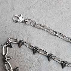 Spiked Wallet Chain A spiked chain link belt with clasps at each end, which can be worn as a wallet chain or a necklace. Length: 25.2"/64cm. Material: Stainless Steel/Alloy. Jean Chains, Womens Techwear, Mens Techwear, Chain Pants, Jeans Chain, Pants Chain, Techwear Pants, Pant Chains, Punk Accessories