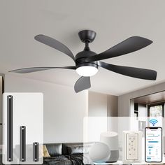 a black ceiling fan sitting on top of a living room floor next to a couch