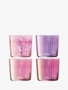 three pink and purple glasses sitting next to each other