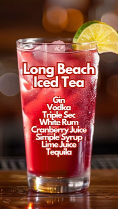 the long beach iced tea is served in a tall glass with lime wedge and garnish