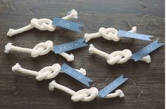 several white ropes with blue labels on them