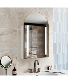 a bathroom sink with a mirror above it next to a wall mounted faucet