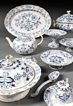 an assortment of blue and white porcelain items